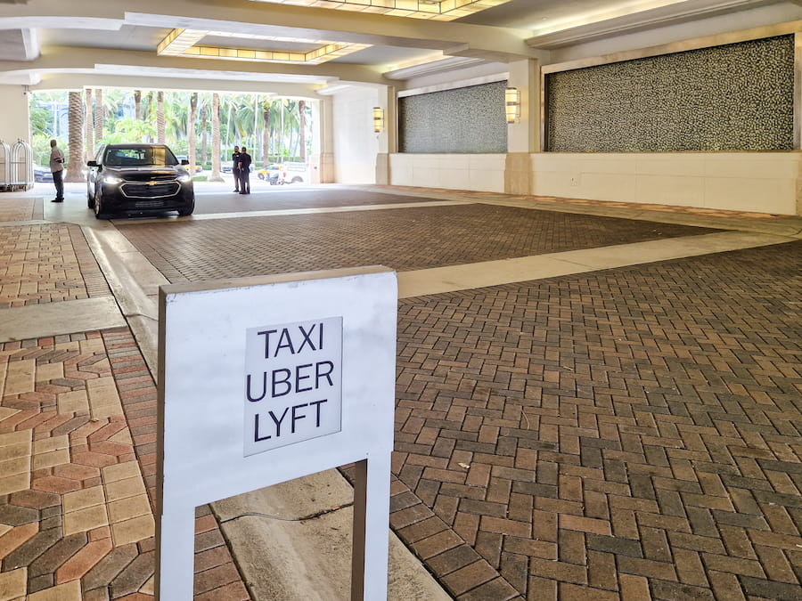 Taxi, Uber and Lyft sign at hotel entrance in Miami