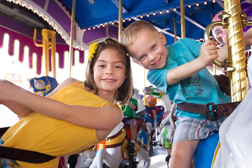 Carousel ride, two kids