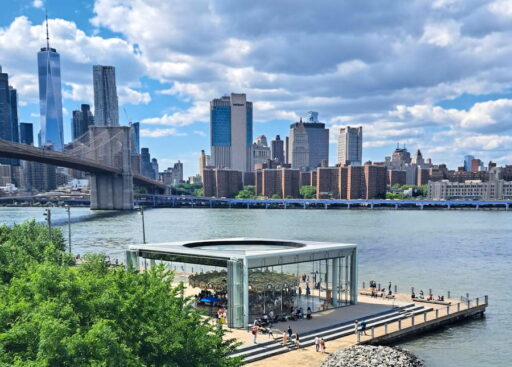 Brooklyn Bridge and skyline of Lower Manhattan. In front Jane's Carousel