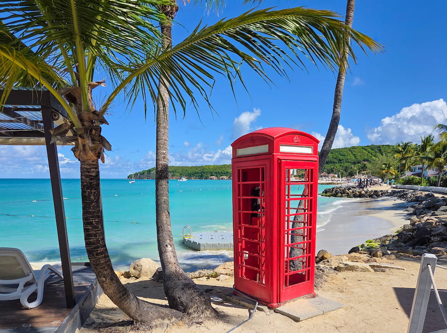 Dickenson Bay beach, red telephone box