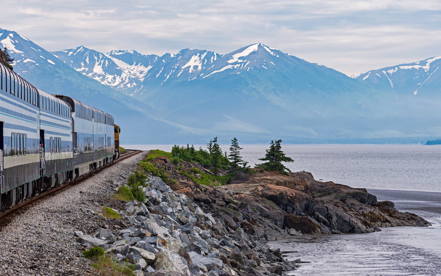 Alaska Railroad train with mountains and glaciers in the background